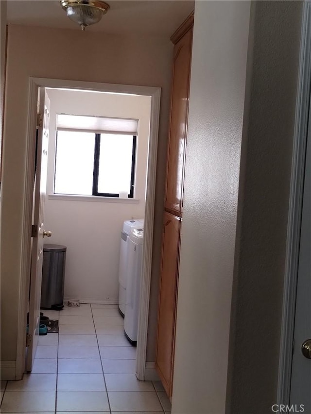 13205 Santa Lucia Rd, Atascadero, CA 93422 - laundry area with washer and dryer, light tile patterned flooring, and cabinet space