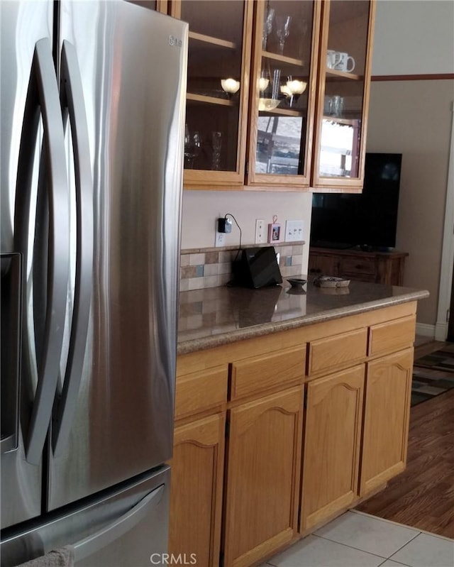 13205 Santa Lucia Rd, Atascadero, CA 93422 - kitchen with freestanding refrigerator, glass insert cabinets, and light countertops