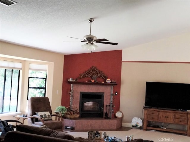 13205 Santa Lucia Rd, Atascadero, CA 93422 - living room featuring a ceiling fan, lofted ceiling, and a tile fireplace