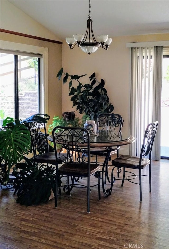 13205 Santa Lucia Rd, Atascadero, CA 93422 - dining room featuring wood finished floors, lofted ceiling, and a chandelier