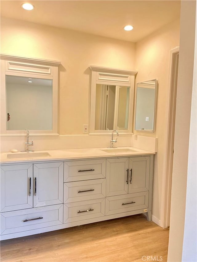5800 Kanan Rd Unit 167, Agoura Hills, CA 91301 - bathroom featuring double vanity, wood finished floors, and recessed lighting
