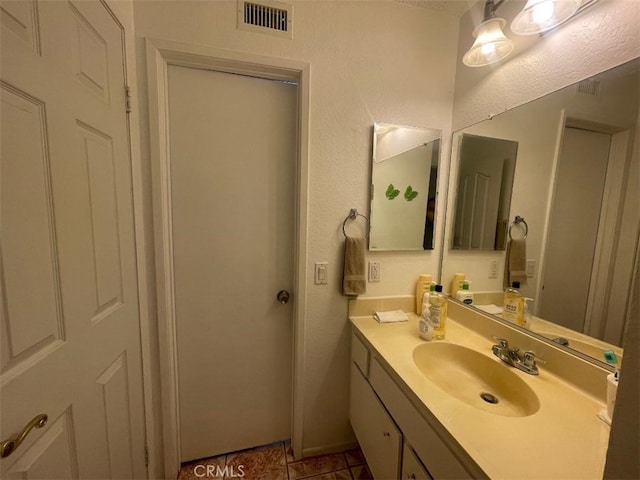 14194 Old Field Ave, Fontana, CA 92337 - bathroom with vanity and tile patterned floors