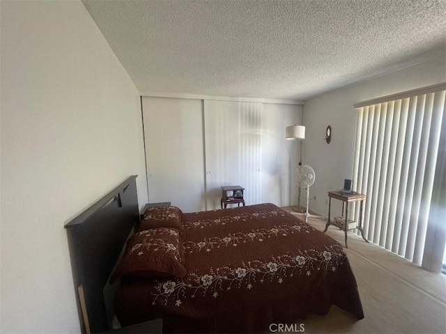 14194 Old Field Ave, Fontana, CA 92337 - carpeted bedroom with a textured ceiling and a closet