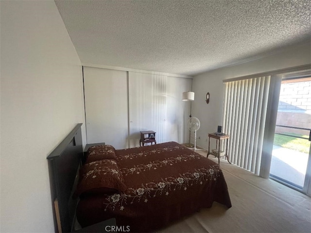 14194 Old Field Ave, Fontana, CA 92337 - carpeted bedroom with a textured ceiling, access to exterior, and a closet