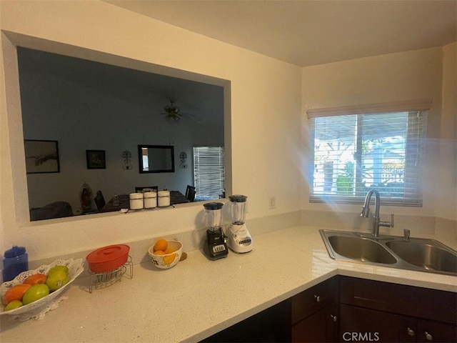 14194 Old Field Ave, Fontana, CA 92337 - kitchen featuring dark brown cabinets, light countertops, and ceiling fan