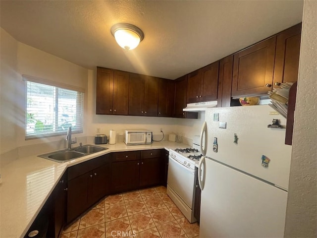 14194 Old Field Ave, Fontana, CA 92337 - kitchen featuring white appliances, under cabinet range hood, light countertops, light tile patterned floors, and dark brown cabinets