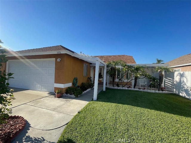14194 Old Field Ave, Fontana, CA 92337 - view of front of property featuring stucco siding, a front yard, an attached garage, and driveway