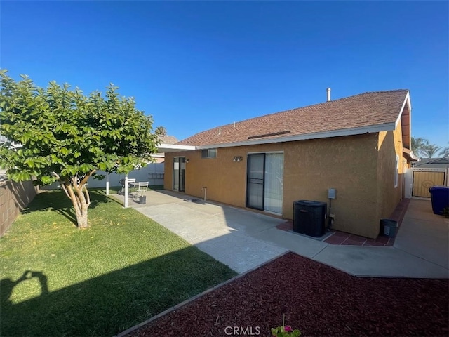14194 Old Field Ave, Fontana, CA 92337 - rear view of house featuring stucco siding, a fenced backyard, a patio, and a shingled roof