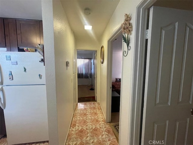 14194 Old Field Ave, Fontana, CA 92337 - hallway with light tile patterned floors