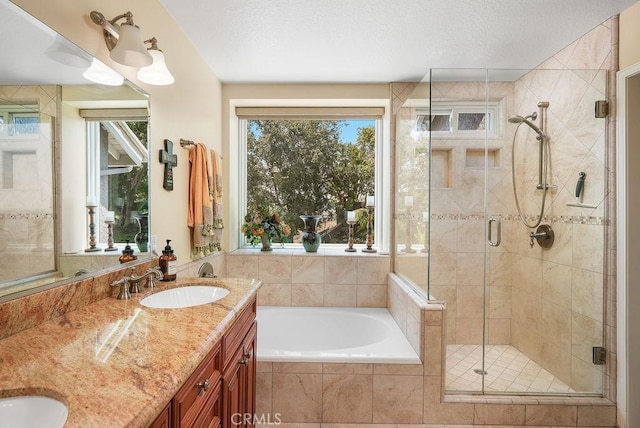 28606 Vista Ladera, Laguna Niguel, CA 92677 - bathroom featuring a garden tub, a stall shower, double vanity, and a textured ceiling