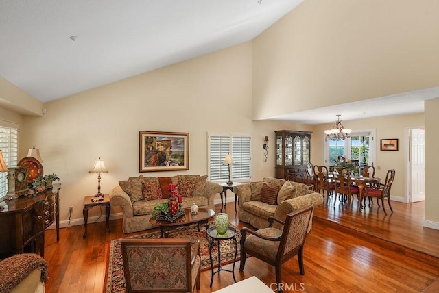 28606 Vista Ladera, Laguna Niguel, CA 92677 - living room with wood-type flooring, a chandelier, and high vaulted ceiling