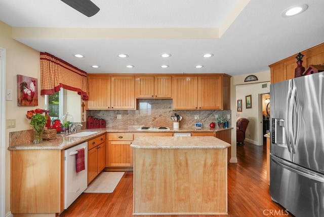 28606 Vista Ladera, Laguna Niguel, CA 92677 - kitchen with stainless steel refrigerator with ice dispenser, dishwasher, light wood-style flooring, a kitchen island, and backsplash
