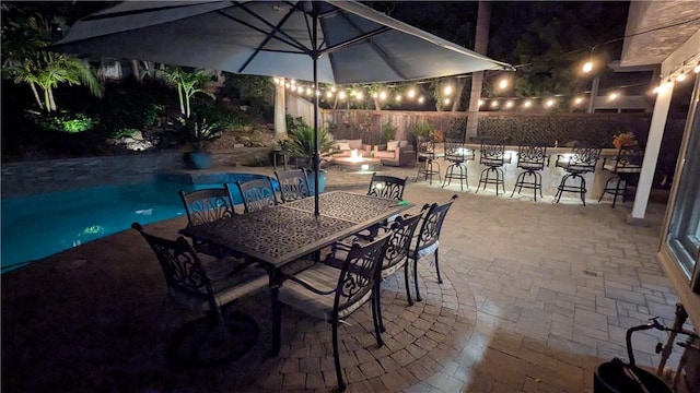 28606 Vista Ladera, Laguna Niguel, CA 92677 - patio at night featuring a patio, an outdoor pool, and an outdoor fire pit