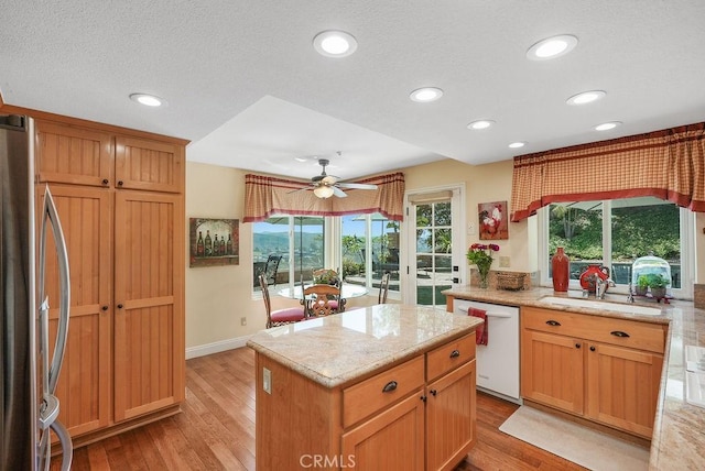 28606 Vista Ladera, Laguna Niguel, CA 92677 - kitchen with stainless steel fridge, white dishwasher, a ceiling fan, recessed lighting, and a kitchen island