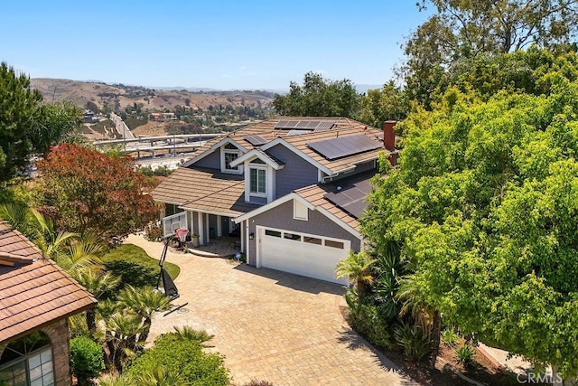 28606 Vista Ladera, Laguna Niguel, CA 92677 - view of front of home featuring solar panels, decorative driveway, and an attached garage