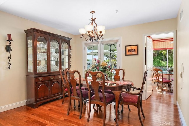 28606 Vista Ladera, Laguna Niguel, CA 92677 - dining room with a chandelier, plenty of natural light, and light wood-style flooring