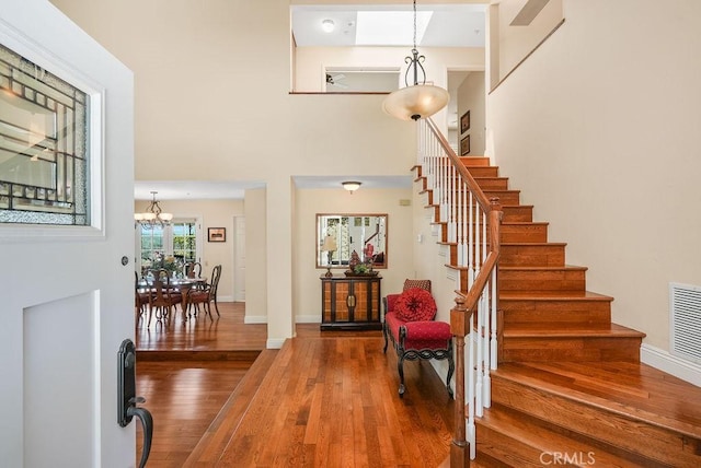 28606 Vista Ladera, Laguna Niguel, CA 92677 - foyer with wood finished floors, stairway, a chandelier, and a high ceiling