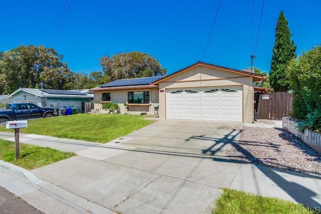3018 Thunder Dr, Oceanside, CA 92056 - ranch-style house with stucco siding, solar panels, driveway, and an attached garage