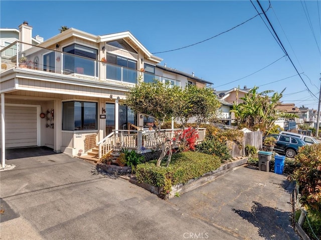 3277 Ocean Blvd, Cayucos, CA 93430 - view of front of property featuring an attached garage, covered porch, and asphalt driveway