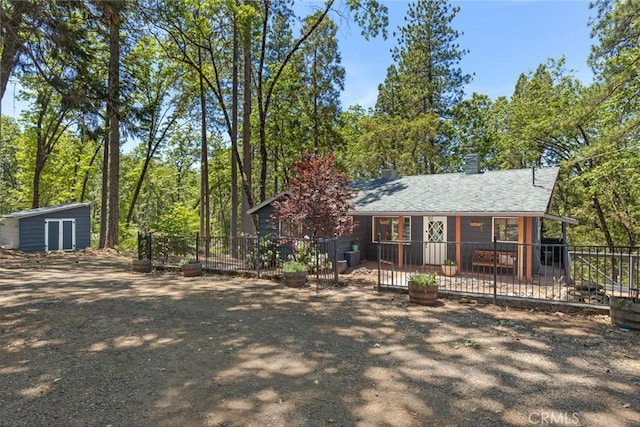 4934 Tippitoe Ln, Forest Ranch, CA 95942 - view of front of home featuring a storage unit and a chimney