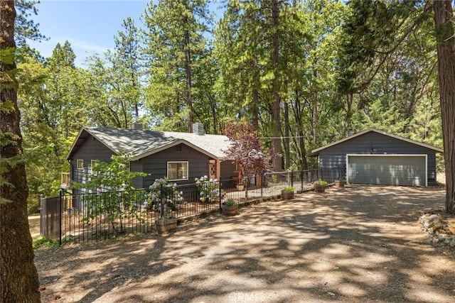 4934 Tippitoe Ln, Forest Ranch, CA 95942 - view of front of property featuring a detached garage, an outdoor structure, a chimney, and a shingled roof