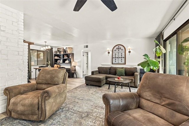 4934 Tippitoe Ln, Forest Ranch, CA 95942 - living area featuring ceiling fan, wood finished floors, and a chandelier