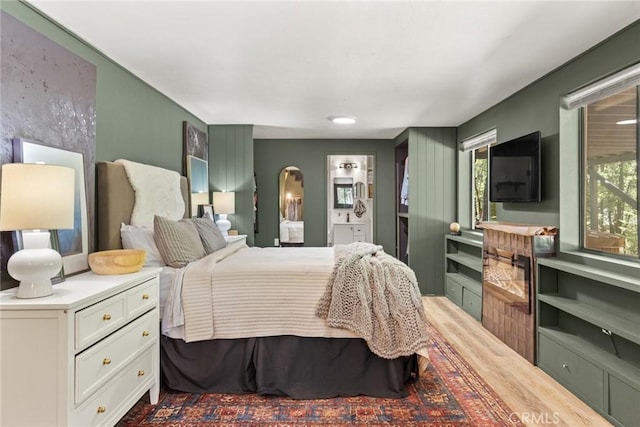 4934 Tippitoe Ln, Forest Ranch, CA 95942 - bedroom with arched walkways and wood finished floors
