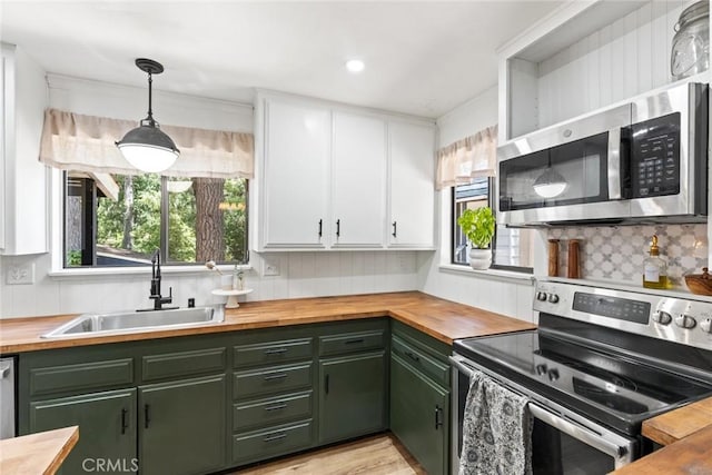 4934 Tippitoe Ln, Forest Ranch, CA 95942 - kitchen with green cabinets, stainless steel appliances, and wooden counters
