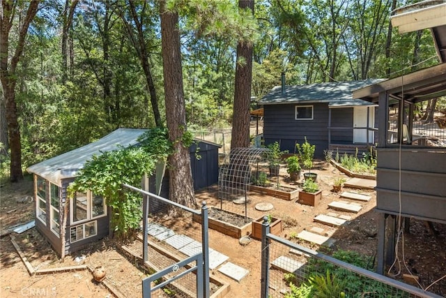 4934 Tippitoe Ln, Forest Ranch, CA 95942 - view of yard featuring a garden and a storage unit