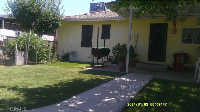 1033 Chapel Dr, Bakersfield, CA 93304 - back of house featuring stucco siding and a chimney