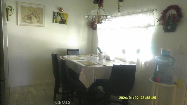 1033 Chapel Dr, Bakersfield, CA 93304 - dining area featuring wood finished floors and a chandelier
