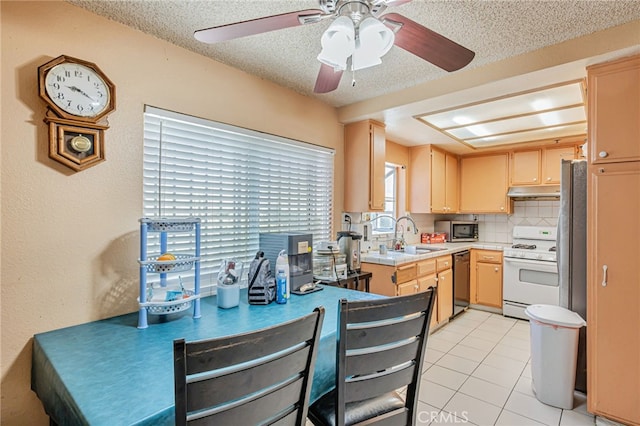 8828 Burnet Ave Unit 9, North Hills, CA 91343 - kitchen with white range with gas cooktop, dishwasher, stainless steel microwave, a ceiling fan, and under cabinet range hood