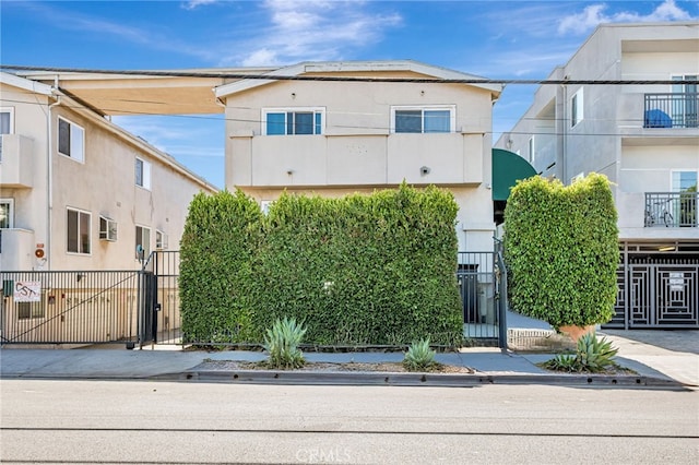 8828 Burnet Ave Unit 9, North Hills, CA 91343 - view of front facade featuring a gate and stucco siding