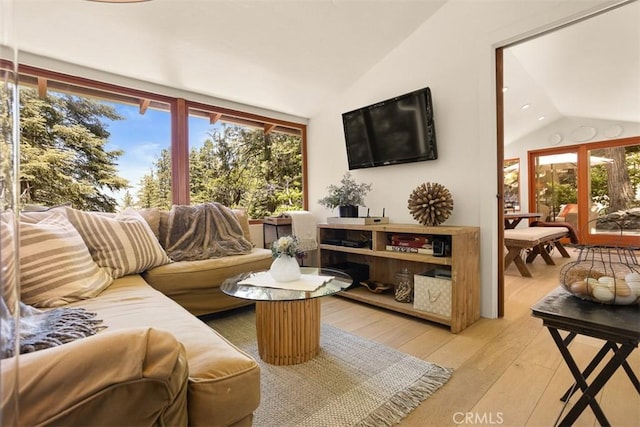 433 Milburn Rd, Lake Arrowhead, CA 92352 - living room featuring lofted ceiling, healthy amount of natural light, and light wood-style flooring