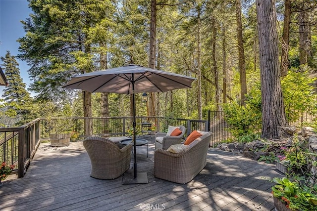 433 Milburn Rd, Lake Arrowhead, CA 92352 - wooden terrace featuring an outdoor hangout area and a forest view