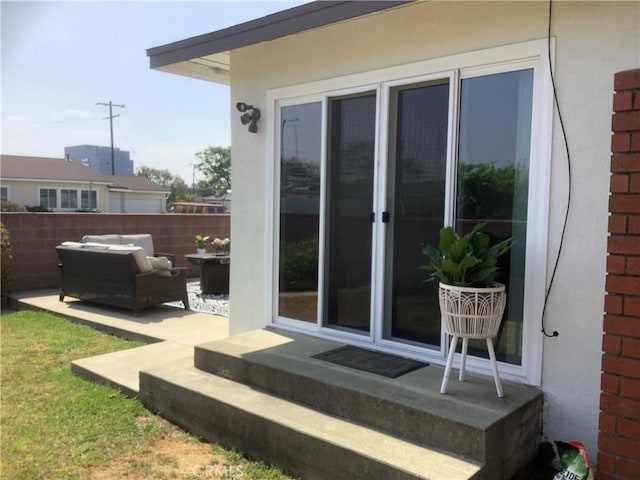 1201 W 186th St, Gardena, CA 90248 - entrance to property featuring stucco siding, an outdoor living space, and a patio