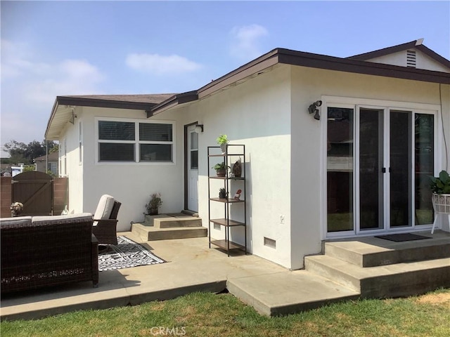1201 W 186th St, Gardena, CA 90248 - rear view of property with stucco siding, a gate, and a patio