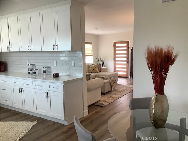 1201 W 186th St, Gardena, CA 90248 - kitchen with tasteful backsplash, wood finished floors, light countertops, and white cabinets