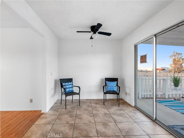 9383 11th Ave, Hesperia, CA 92345 - living area with a textured ceiling, ceiling fan, and light wood-type flooring