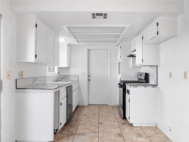 9383 11th Ave, Hesperia, CA 92345 - kitchen with stainless steel appliances, under cabinet range hood, white cabinets, light tile patterned floors, and light countertops