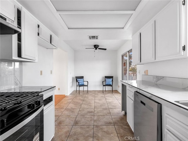 9383 11th Ave, Hesperia, CA 92345 - kitchen with dishwasher, black gas range oven, ceiling fan, ventilation hood, and white cabinets