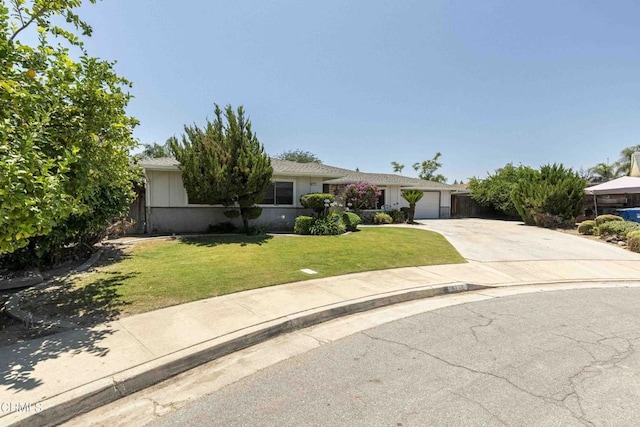 4713 Perris Way, Bakersfield, CA 93309 - view of front facade featuring driveway, an attached garage, and a front yard