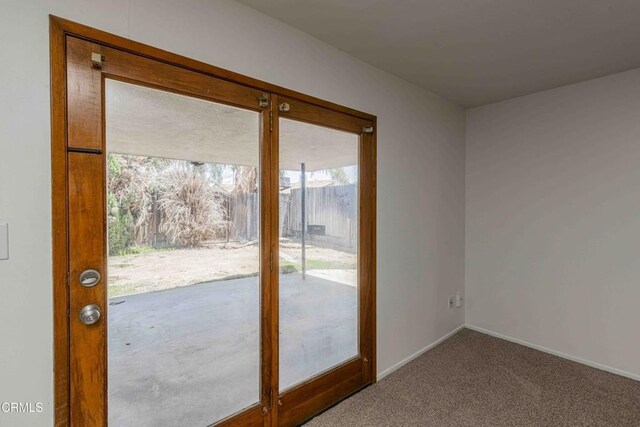 4713 Perris Way, Bakersfield, CA 93309 - doorway to outside featuring carpet and baseboards