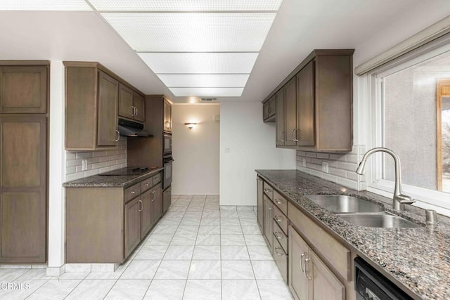4713 Perris Way, Bakersfield, CA 93309 - kitchen featuring dishwashing machine, under cabinet range hood, black electric cooktop, tasteful backsplash, and dark stone countertops