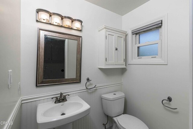 4713 Perris Way, Bakersfield, CA 93309 - bathroom featuring a sink and wainscoting