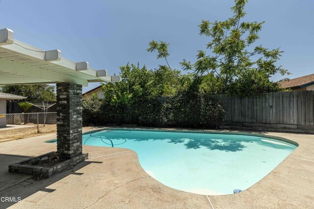 4713 Perris Way, Bakersfield, CA 93309 - view of pool featuring a fenced backyard and a patio area