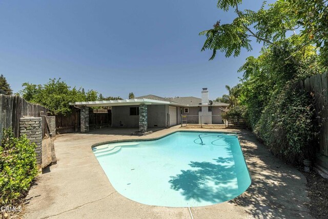 4713 Perris Way, Bakersfield, CA 93309 - view of pool featuring a fenced backyard and a patio