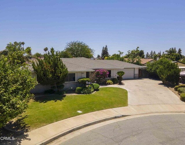 4713 Perris Way, Bakersfield, CA 93309 - view of front of property featuring a garage, concrete driveway, and a front yard