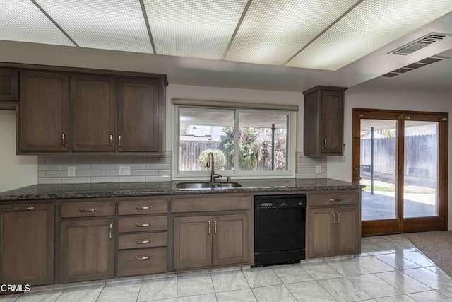 4713 Perris Way, Bakersfield, CA 93309 - kitchen with dishwasher, dark stone counters, plenty of natural light, and tasteful backsplash