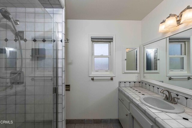 4713 Perris Way, Bakersfield, CA 93309 - full bathroom featuring vanity, a shower stall, and tile patterned floors